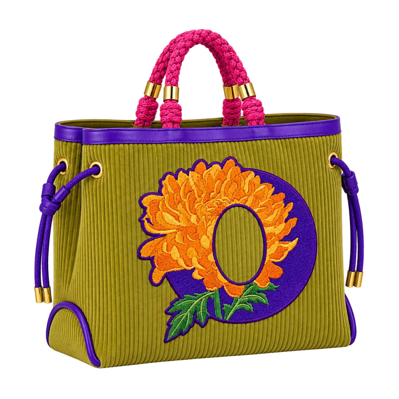 An olive green corduroy tote bag featuring thick braided pink top handles, purple leather trim, gold-tone hardware, and a large embroidered letter "O" patch with a vibrant orange chrysanthemum flower and green leaves.