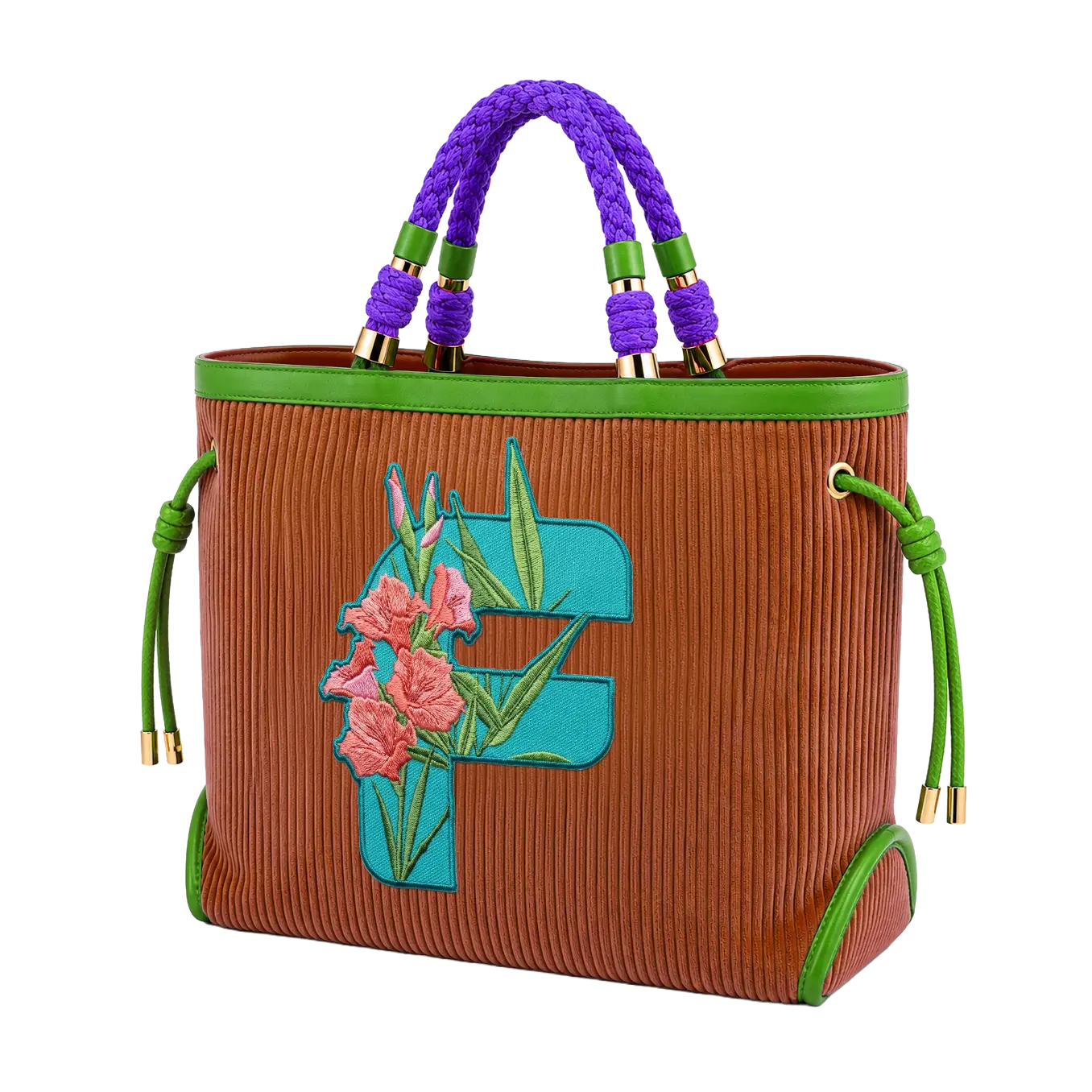A copper-brown corduroy tote bag featuring thick braided purple top handles, green leather trim, gold-tone hardware, and a large embroidered letter "F" patch with pink flowers and green foliage.