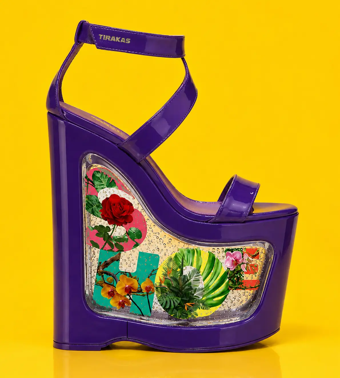 A deep purple patent leather platform high heel featuring a clear resin wedge window filled with botanical letter graphics and floral patterns, set against a solid yellow background.