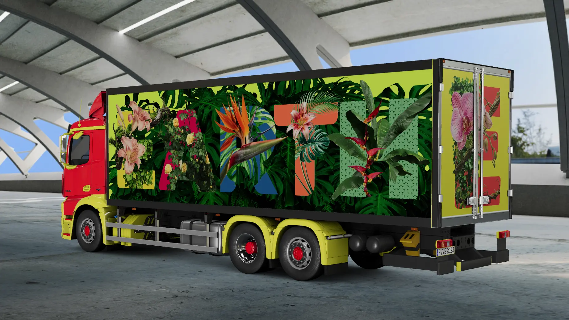 A driver-side rear-quarter view of the heavy-duty Tirakas delivery truck parked inside a modern architectural structure, showcasing the full botanical "EARTH" graphic wrap and red-and-yellow cab.